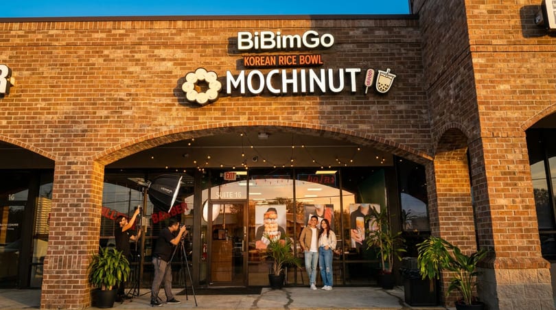 BiBimGo and Mochinut storefront with two photographers and a couple posing outside.